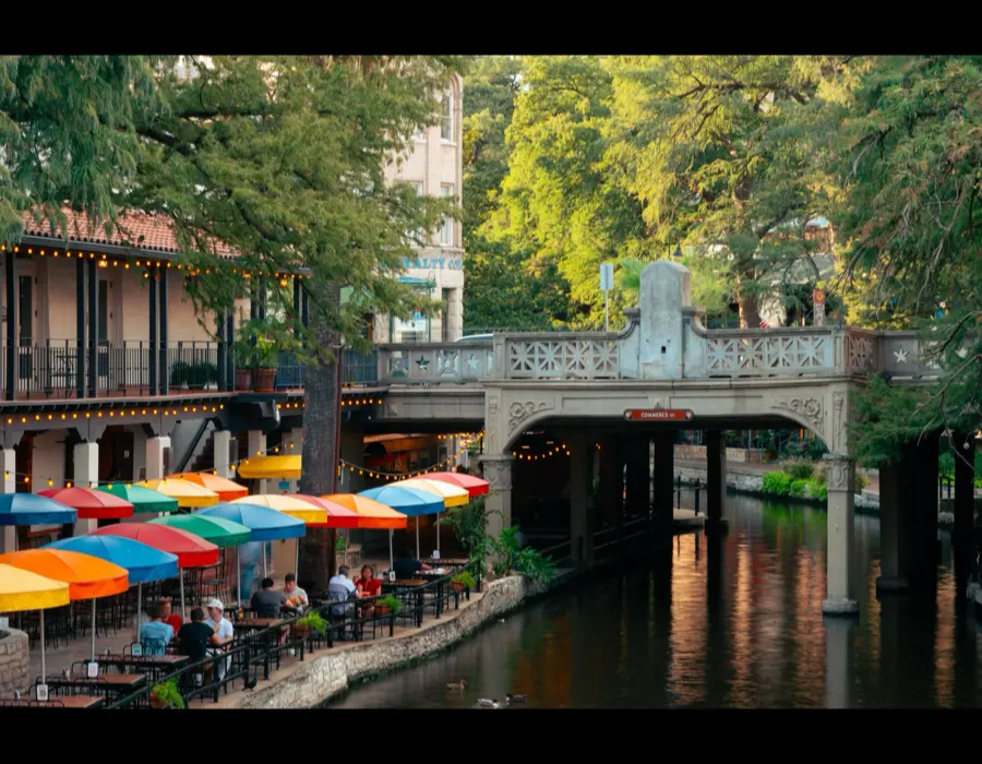 The San Antonio River Walk at golden hour, near the Commerce Street bridge.